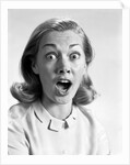 1960s head shot woman eyes and mouth wide open terrified expression looking at camera by Anonymous