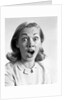 1960s head shot woman eyes and mouth wide open terrified expression looking at camera by Anonymous