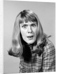 1960s head shot angry woman looking at camera by Anonymous