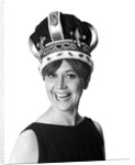 1970s smiling portrait woman wearing queen's crown looking at camera by Anonymous