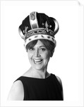 1970s smiling portrait woman wearing queen's crown looking at camera by Anonymous