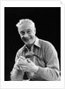 1920s smiling man marking golf club scorecard looking at camera by Anonymous