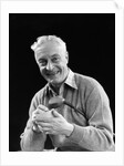 1920s smiling man marking golf club scorecard looking at camera by Anonymous