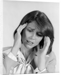 1980s portrait woman hands massaging temple forehead headache distress stress by Anonymous