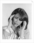 1980s portrait woman hands massaging temple forehead headache distress stress by Anonymous