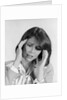 1980s portrait woman hands massaging temple forehead headache distress stress by Anonymous