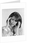 1980s portrait woman hands massaging temple forehead headache distress stress by Anonymous