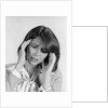 1980s portrait woman hands massaging temple forehead headache distress stress by Anonymous