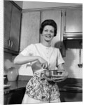 1960s woman kitchen housewife stir by Anonymous