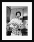 1960s woman kitchen housewife stir by Anonymous