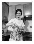 1960s woman kitchen housewife stir by Anonymous