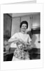 1960s woman kitchen housewife stir by Anonymous