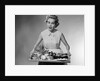 1950s woman looking at camera speaking holding platter of hors d'oeuvres snacks by Anonymous