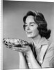 1950s 1960s woman smelling aroma of freshly baked pie by Anonymous