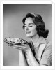 1950s 1960s woman smelling aroma of freshly baked pie by Anonymous