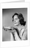 1950s 1960s woman smelling aroma of freshly baked pie by Anonymous