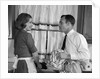 1960s man woman washing dishes kitchen sink by Anonymous