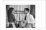 1960s man woman washing dishes kitchen sink by Anonymous