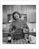 1960s woman baking in kitchen by Anonymous