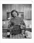 1960s woman baking in kitchen by Anonymous
