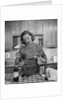 1960s woman baking in kitchen by Anonymous