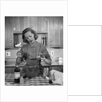 1960s woman baking in kitchen by Anonymous