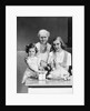 1940s 1950s mother daughter grandmother stuffing turkey by Anonymous