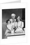 1940s 1950s mother daughter grandmother stuffing turkey by Anonymous