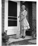 1940s smiling woman sweeping porch front door step with a broom looking at camera by Anonymous