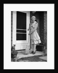 1940s smiling woman sweeping porch front door step with a broom looking at camera by Anonymous