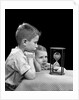 1940s two boys waiting watching sand falling in hourglass by Anonymous