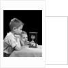 1940s two boys waiting watching sand falling in hourglass by Anonymous