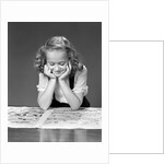 1940s child reading newspaper comics smiling by Anonymous