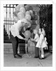 1960s children boy girl getting a balloon from man by Anonymous