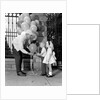 1960s children boy girl getting a balloon from man by Anonymous