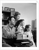1960s happy family looking at slides on slide projector by Anonymous