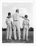 1960s back view grandfather with two grandsons boys by Anonymous