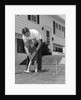 1960s father and young daughter playing croquet in yard by Anonymous