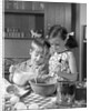 1960s two children boy girl bowl mixing pouring milk in kitchen by Anonymous