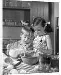 1960s two children boy girl bowl mixing pouring milk in kitchen by Anonymous