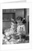 1960s two children boy girl bowl mixing pouring milk in kitchen by Anonymous
