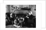 1930s family of four sitting in front fireplace mother knitting father reading smoking pipe kids doing homework by Anonymous