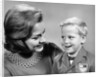 1960s portrait mother with arm around son dressed in school uniform with bow tie & emblem crest on jacket mom pearl lace collar by Anonymous