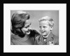 1960s portrait mother with arm around son dressed in school uniform with bow tie & emblem crest on jacket mom pearl lace collar by Anonymous