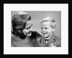 1960s portrait mother with arm around son dressed in school uniform with bow tie & emblem crest on jacket mom pearl lace collar by Anonymous