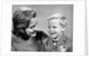 1960s portrait mother with arm around son dressed in school uniform with bow tie & emblem crest on jacket mom pearl lace collar by Anonymous