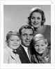 1960s family portrait father mother two sons smiling by Anonymous