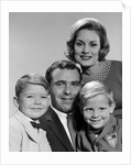 1960s family portrait father mother two sons smiling by Anonymous