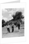 1950s three girls running in grassy field by Anonymous