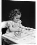1960s 1940s girl child sitting at desk drawing coloring pictures by Anonymous